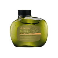 Shampoo-Flasche „Fig + Feijoa“ Repair & Nourish, dunkelgrün mit Etikett und schwarzer Kappe